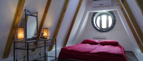 bedroom with porthole
