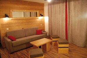 Kick back on the sofa in the open-plan living room and turn on the TV.