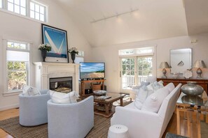 Sunny Living Area Has Fireplace & Wall Of Glass Windows & Sliding Glass Doors To Deck & Porch