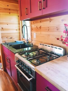 One of a kind tiny home with shared in-ground pool and hot tub