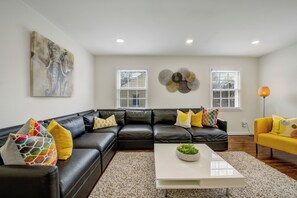 Living Room w/Two Single Size Sofa Beds and 55 Inch Samsung TV