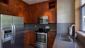 Contemporary kitchen with granite countertops and stainless steel appliances