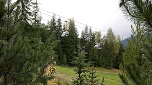 Scenic view of ski slope in summer.