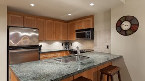 Kitchen with stainless steel appliances and granite countertops