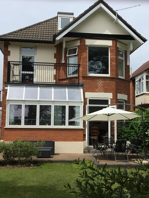 Rear patio with seating and BBQ
