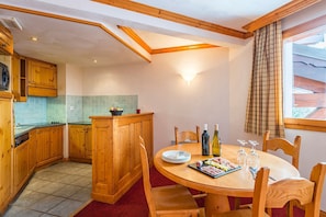 Prepare meals in the kitchenette and enjoy them at the dining table.