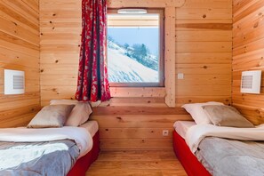 The sleeping area features 2 Single beds (PLEASE NOTE that views vary).