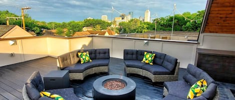 Relax on the rooftop with fire pit, TV and amazing unobstructed downtown views!