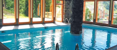 Swim laps in the indoor pool.