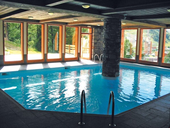Swim laps in the indoor pool.