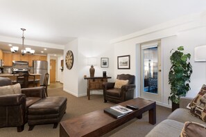 Open concept living, kitchen, and dining areas