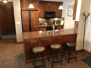 3 leather bar stools to provide extra seating