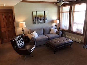 Living room with Pottery Barn furniture.  Sofa opens up to a queen mattress.