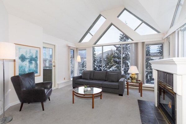 Cozy living area with gas fireplace and TV