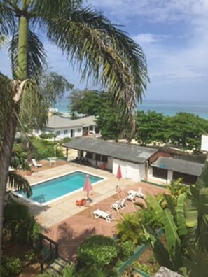 Top Floor Balcony View of Pool and Beach