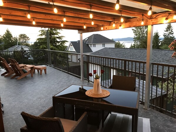 Covered deck with lights and oceanview