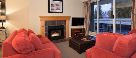 Cozy living area with gas fireplace and 40" TV