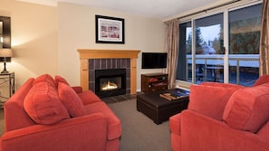 Cozy living area with gas fireplace and 40" TV