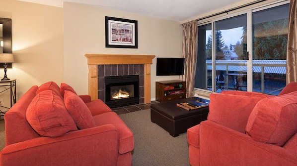 Cozy living area with gas fireplace and 40" TV