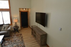 Beautiful Living Room - Beautiful and spacious living room with a large smart TV.
