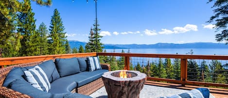 Stunning lake view deck with outdoor furniture