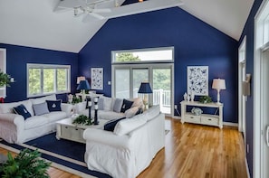 Bright Living Room Features Vaulted Ceilings, Fireplace, Large Seating Area