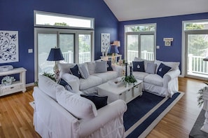 Living Room Has Numerous Sliding Doors To Wraparound Deck