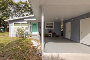 Front of home; covered parking space and free street parking allowed.