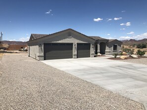 RV parking on side of garage with hookups 