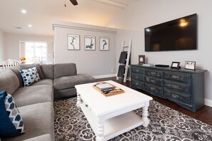 Cozy living area with sectional sofa, 65 inch tv, Blu-ray & DVD movies, etc.