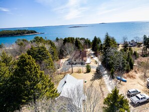 Aerial view of cottage and Atlantic Ocean.