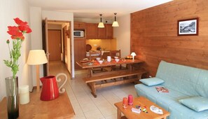 Prepare meals in the kitchenette and enjoy them at the dining table.