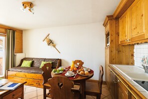 Prepare meals in the kitchenette and enjoy them at the dining table.