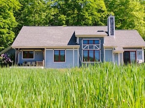 Back of the house with deck, view of meadow