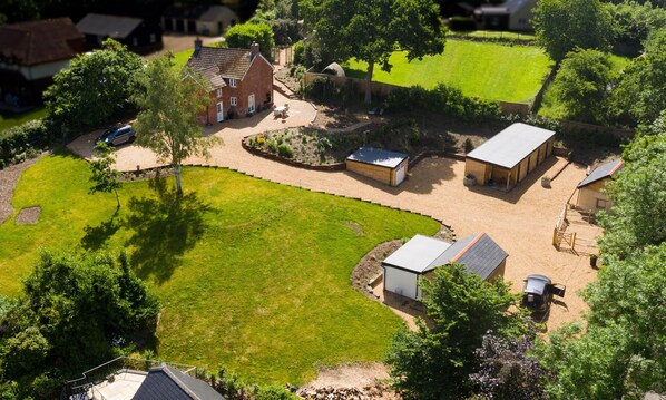 View of garden, outbuildings are locked, old pigsties, garage except cob house