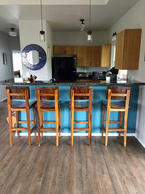 View of bar & kitchen from front door