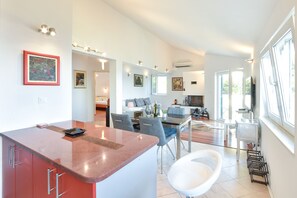 Attic floor kitchen, dining table, living room