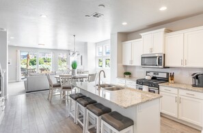 Kitchen Island - The Kitchen Island comfortably seats 4 adults and creates a great space for serving and preparing meals.