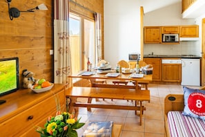 Prepare meals in the kitchenette and enjoy them at the dining table.