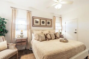 Master bedroom with king-size bed and large closet