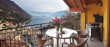 "Argegno Penthouse" The lake view private balcony boasts panoramic scenery .