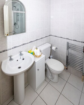 Ensuite Shower room with heated towel rail and toiletries
