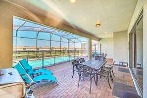 Patio table with chairs and BBQ gas grill.