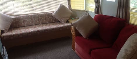 Living area with sofa bed and TV with DVD player 