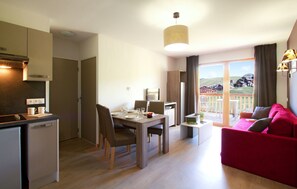 Relax in the living area. Views vary.