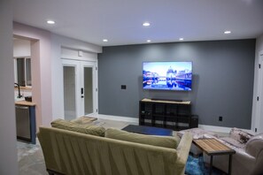 Living Room w/ 65" 4k TV and Bluetooth Entertainment System