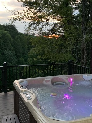 Lower hot tub with a sunset view