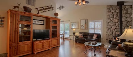 Rustic/Elegant Living Room with wood floors, leather furniture and media Cabinet