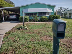 Front view from the mailbox
2 car carport
