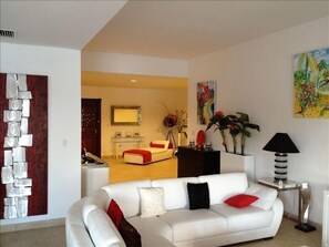 Lounge view and entrance hall. Contemporary, cool and very comfortable